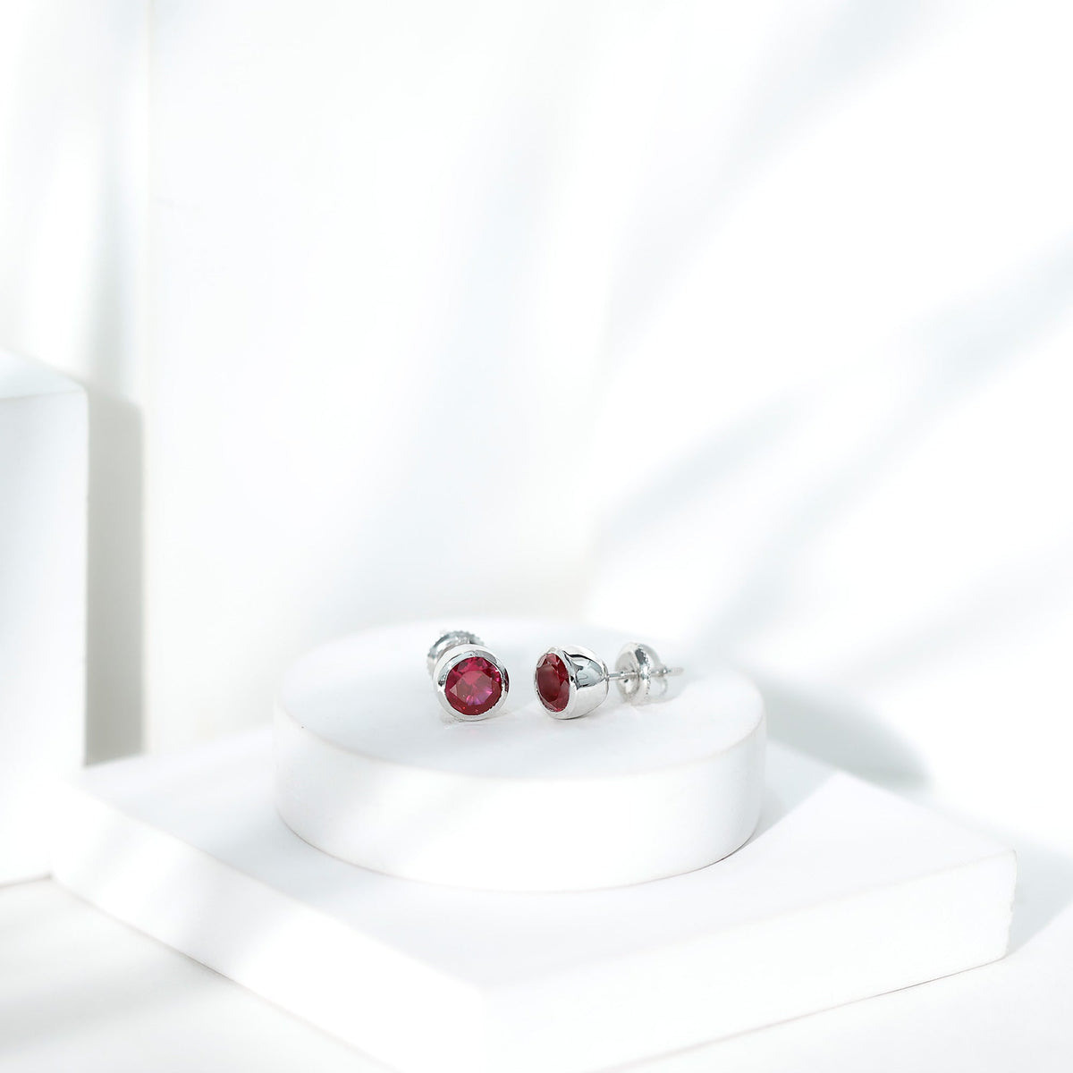 Lab Grown Ruby Solitaire Stud Earrings in Bezel Setting