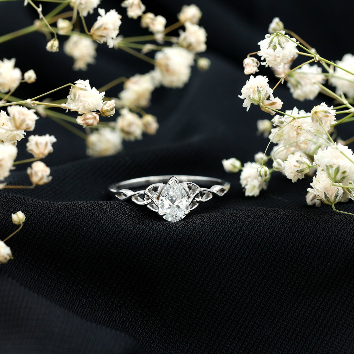Pear Cut 0.79 Carat Moissanite Celtic Engagement Ring