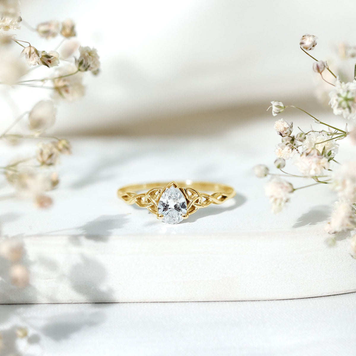 Pear Cut 0.79 Carat Moissanite Celtic Engagement Ring