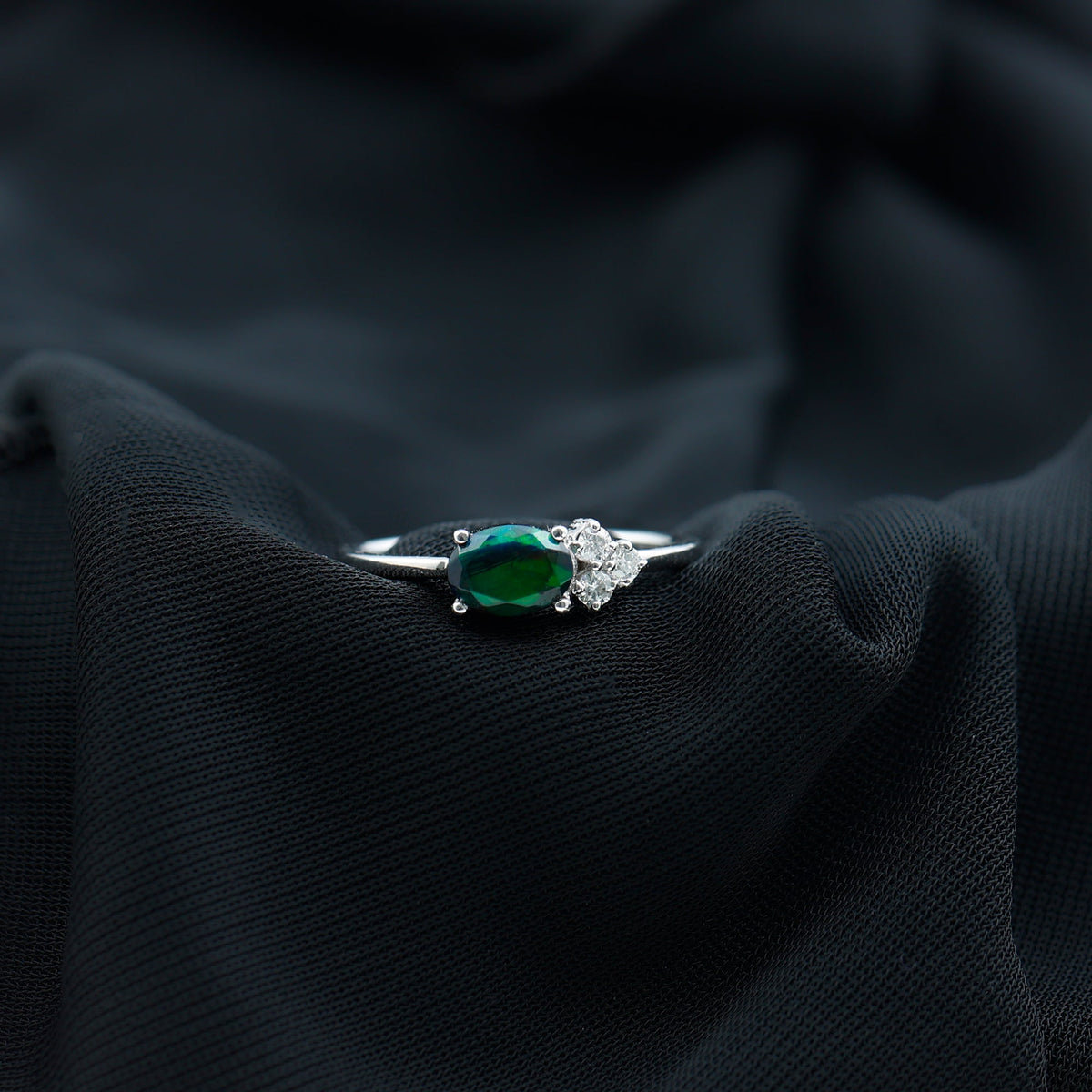 Oval Black Opal East West Ring with Diamond Trio