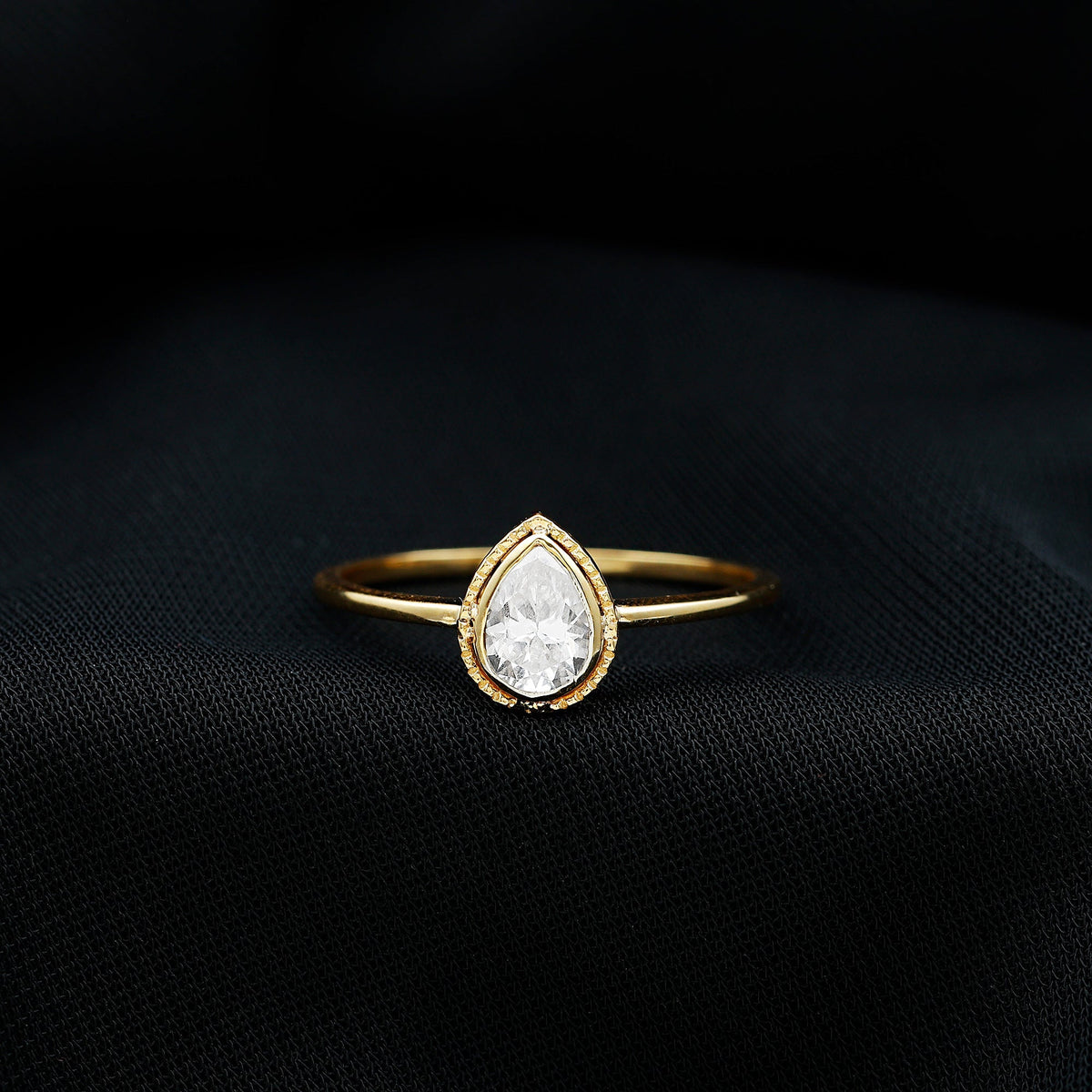 Pear Shaped Moissanite Solitaire Engagement Ring in Bezel Setting